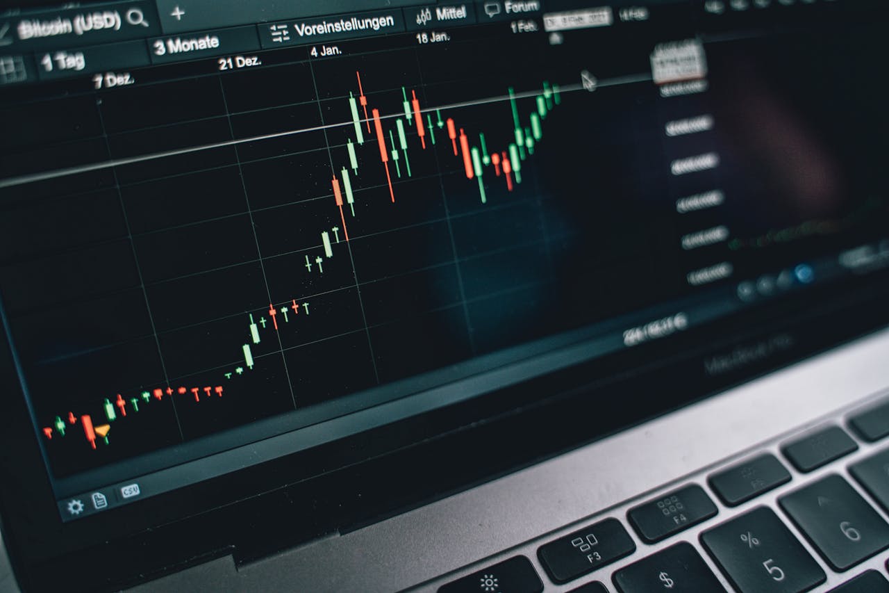 Close-up of a computer screen displaying cryptocurrency market trends and data.