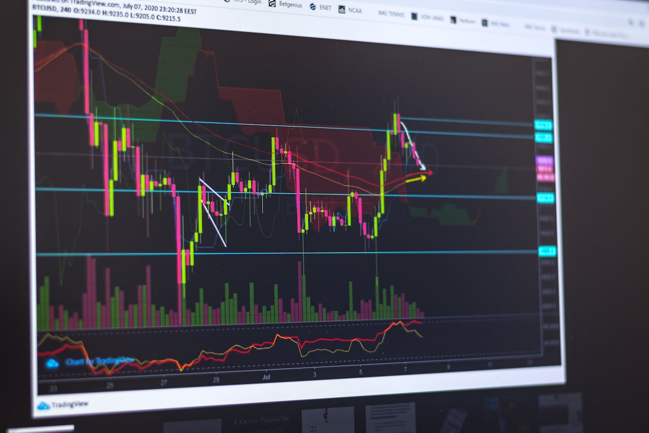 Close-up of a computer screen displaying cryptocurrency market trends and trading data.